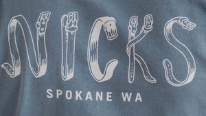 Blue t-shirt with 'Nicks Spokane WA' text on the back
